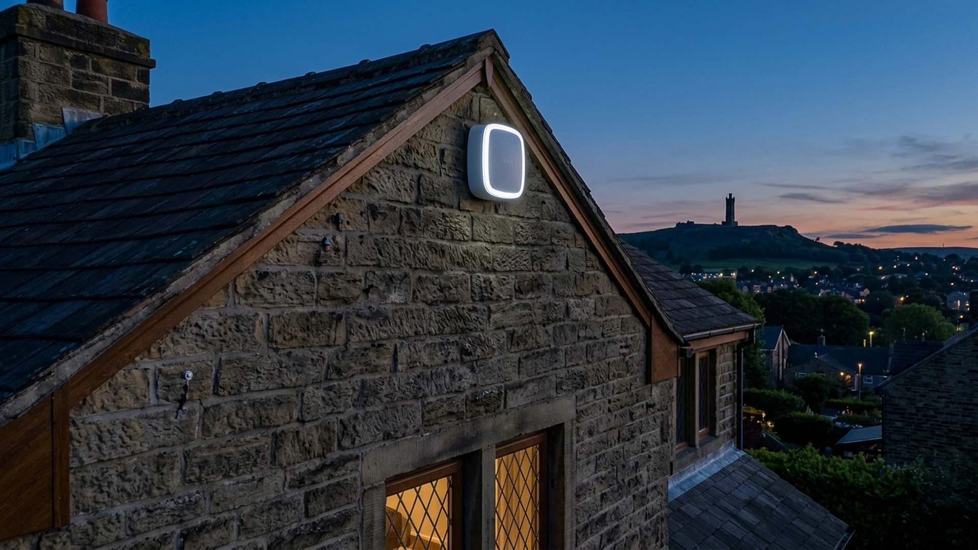 Ajax StreetSiren double outdoor acoustic sounder installed on Huddersfield stone facade